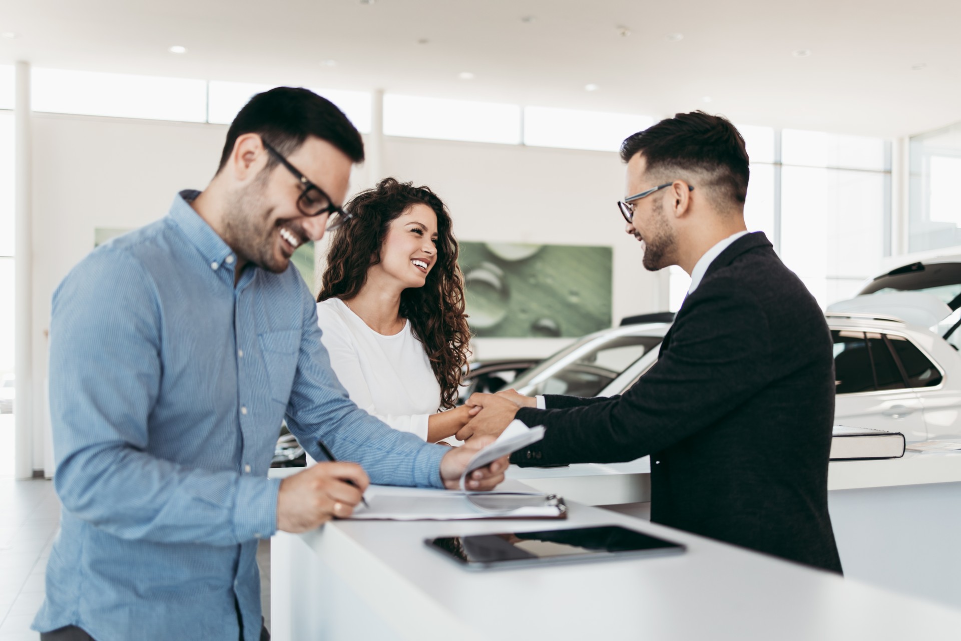 Attractive couple buying new car