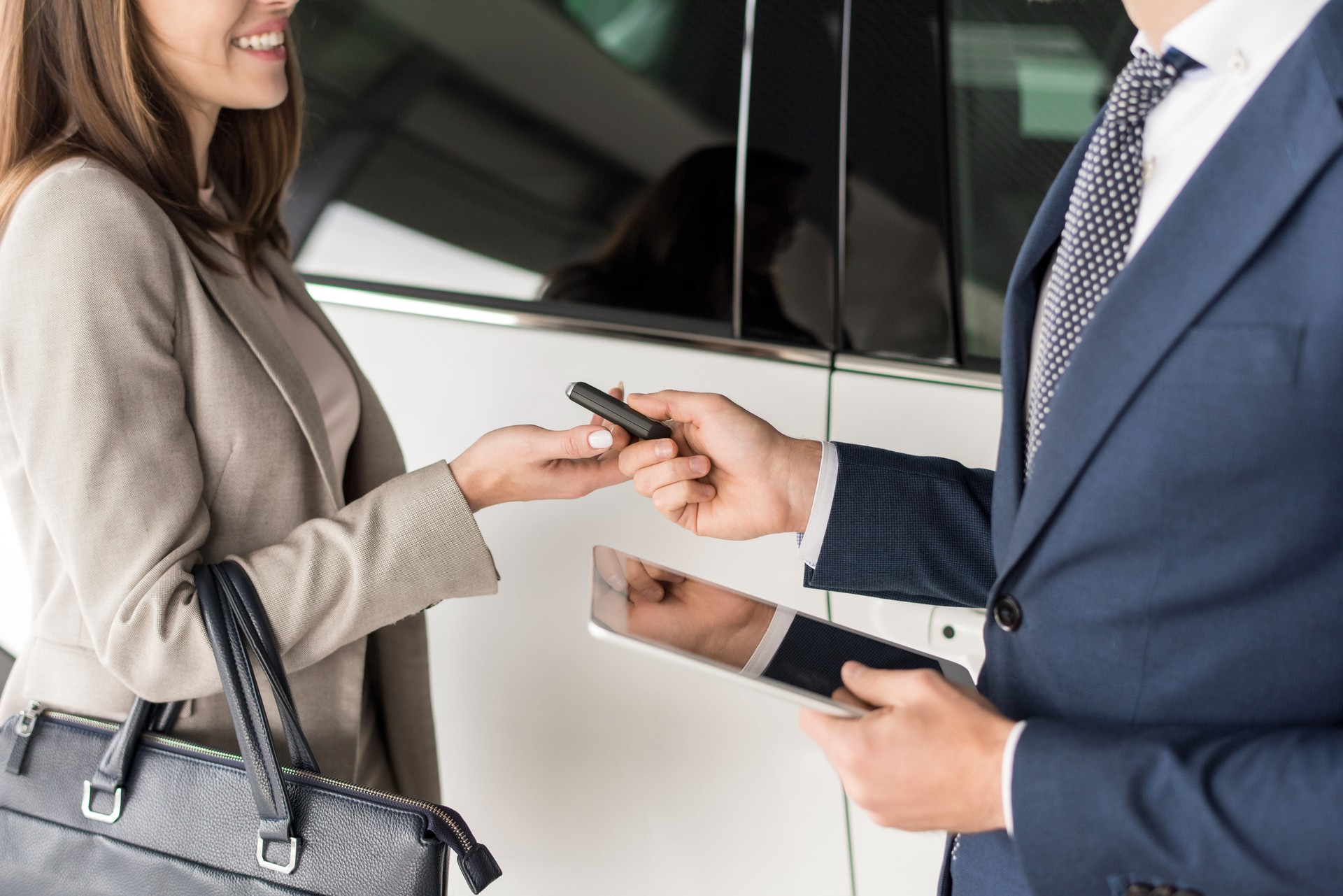 Car Salesman Giving Keys to Client